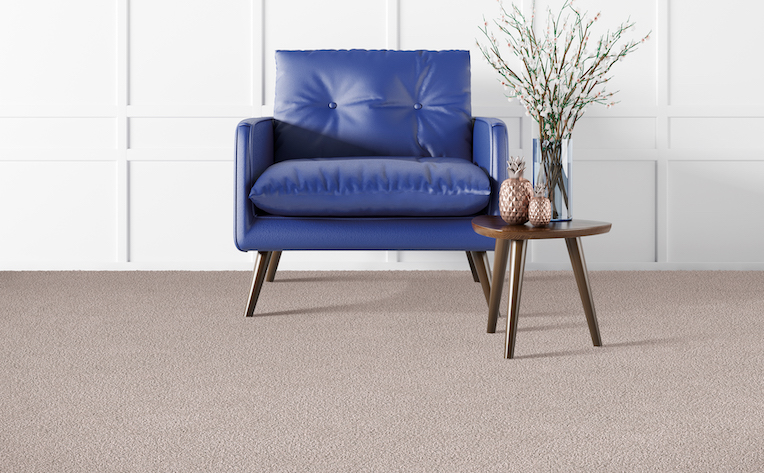 soft beige carpet in a stylish living area with a blue chair and side table