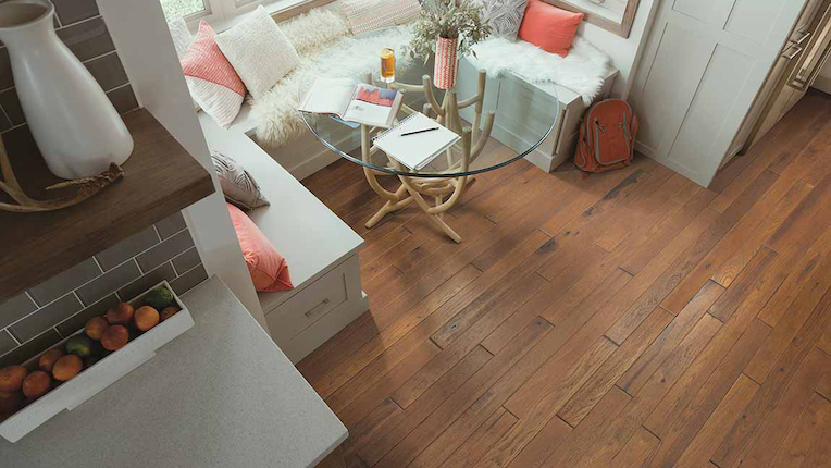 stunning hardwood flooring in a dining room with a window breakfast nook